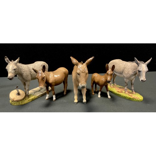 86 - A Beswick model, Donkey mare, grey gloss;  others Jennet and foal, all grey gloss;  a Sherratt & Sim... 