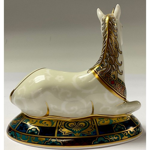 5017 - A Royal Crown Derby paperweight, New Millennium Unicorn, limited edition, 855/2,000, 14cm long, gold... 