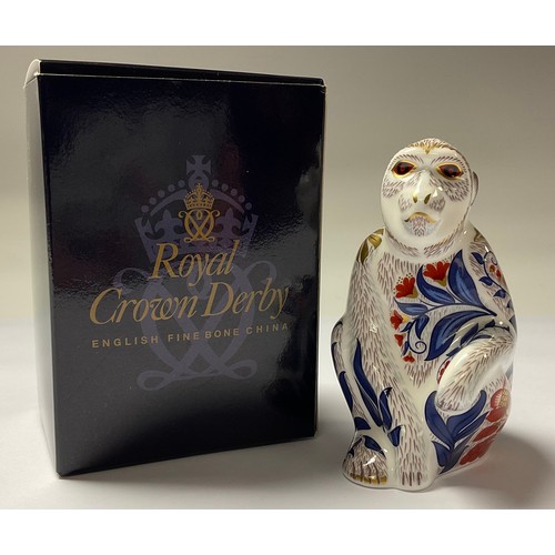 5067 - A Royal Crown Derby paperweight, Macaque, gold stopper,  11.5cm, printed mark in red, boxed