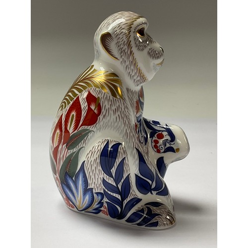 5067 - A Royal Crown Derby paperweight, Macaque, gold stopper,  11.5cm, printed mark in red, boxed