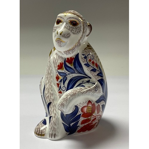 5067 - A Royal Crown Derby paperweight, Macaque, gold stopper,  11.5cm, printed mark in red, boxed