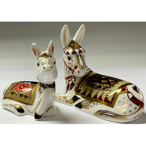 5072 - A pair of Royal Crown Derby paperweights, Thistle Donkey and Holly Foal, exclusively commissioned by... 