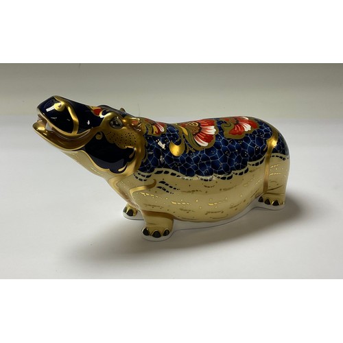 5095 - A Royal Crown Derby paperweight, Hippopotamus, gold stopper, 20cm long, printed mark in red