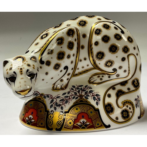 5101 - A Royal Crown Derby paperweight, Snow Leopard, silver stopper, 16cm long, printed mark in red, boxed