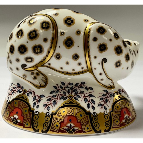 5101 - A Royal Crown Derby paperweight, Snow Leopard, silver stopper, 16cm long, printed mark in red, boxed