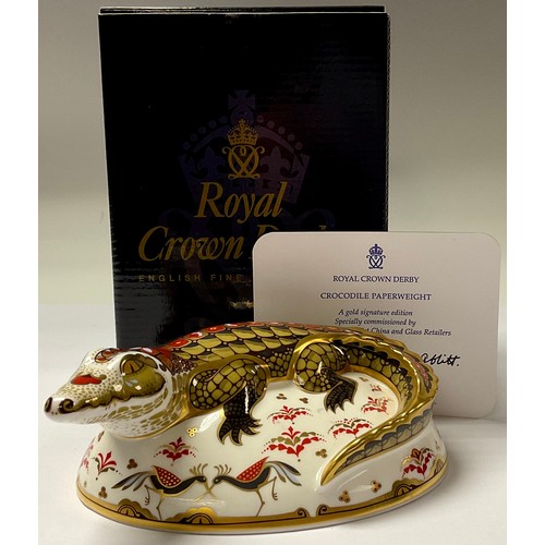 5128 - A Royal Crown Derby paperweight, Crocodile, specially commissioned gold signature edition, gold stop... 