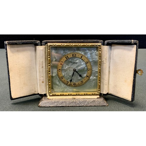 81 - A Mappin gilt metal easel travel clock, gilt chapter ring, Arabic numerals, on a faux mother-of-pear... 