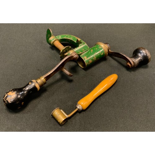 593 - A 19th century brass and steel 12 bore cartridge loader, partially painted green;  a powder measurer... 