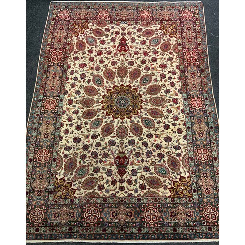 690 - A Persian Tabriz hand-knotted rug / carpet, wool and silk mix, with central circular medallion withi... 