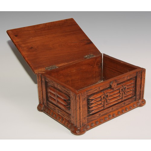 13 - An unusual hardwood rectangular cigar box, carved and surmounted with bundles of cigars, 30cm wide, ... 