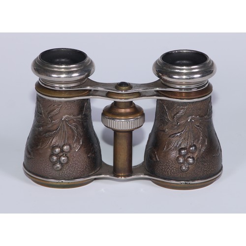 654 - A pair of French Aesthetic Movement opera glasses, decorated in relief with birds on fruiting branch... 