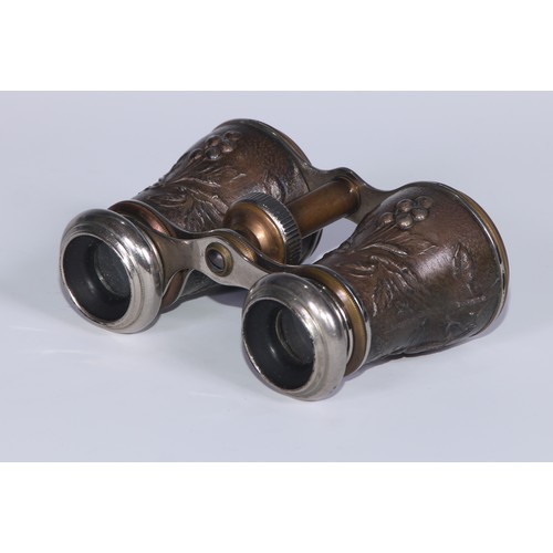 654 - A pair of French Aesthetic Movement opera glasses, decorated in relief with birds on fruiting branch... 