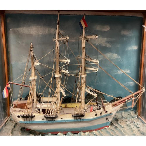 661 - A late 19th century scratch built model of a three mast sailing ship, Cristina, cased, the diorama 5... 