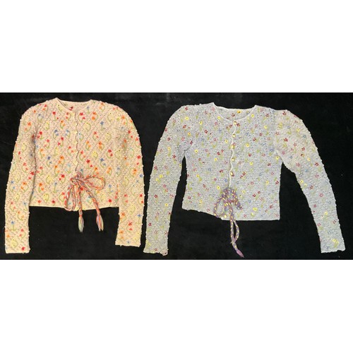 667 - Textiles - fashion, a 1940s hand knitted utility period cardigan, applied with colourful flowers on ... 