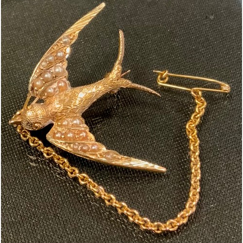 730 - A 15ct gold seed pearl Swallow brooch, modelled in full flight,, 31mm x 26mm,  stamped 15ct, 3.6g gr... 