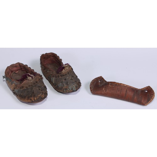 676 - A pair of 19th century Ottoman child’s shoes, 13cm long, old collector’s label inscribed Constantino... 