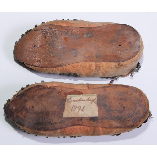 676 - A pair of 19th century Ottoman child’s shoes, 13cm long, old collector’s label inscribed Constantino... 