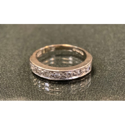 737 - A diamond ring, linear set with seven round brilliant cut diamonds, total estimated diamond weight a... 