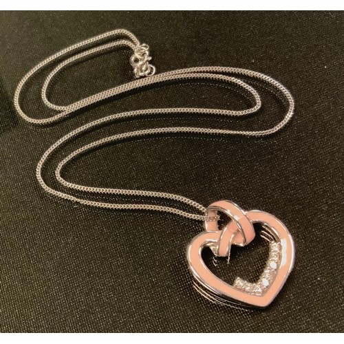 750 - An enamelled 18ct white gold diamond heart pendant necklace, pink enamelled heart set with eight rou... 