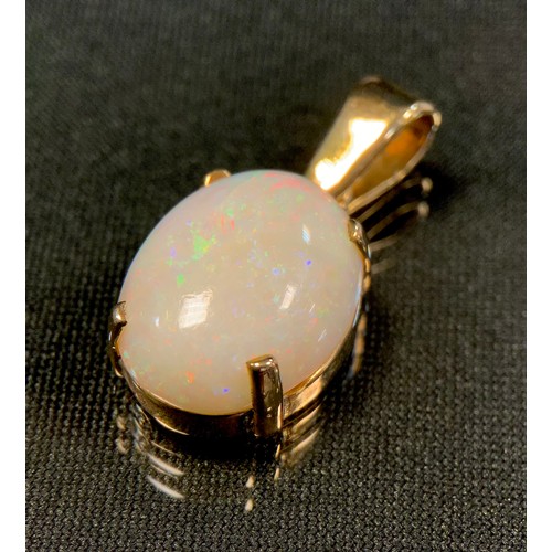 751 - A large oval white opal cabochon pendant, approx 16.35mm x 12.42mm x 5.79mm, 9ct gold mount, Birming... 