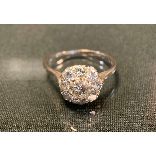 760 - A diamond cluster ring, central old brilliant cut diamond approx 0.50ct surrounded by eight smaller ... 