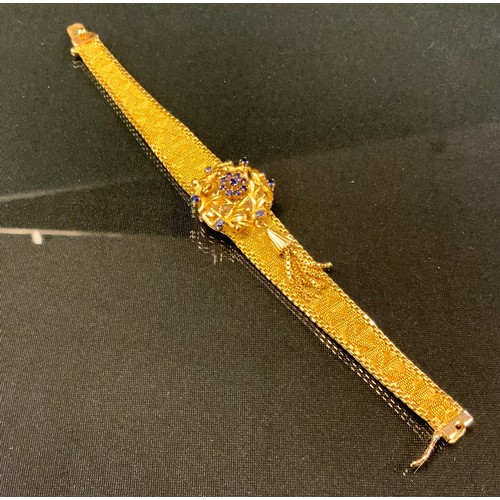 713 - A Pryngeps extra incabloc sapphire set bracelet wristwatch, the hinged floral cover set with fifteen... 