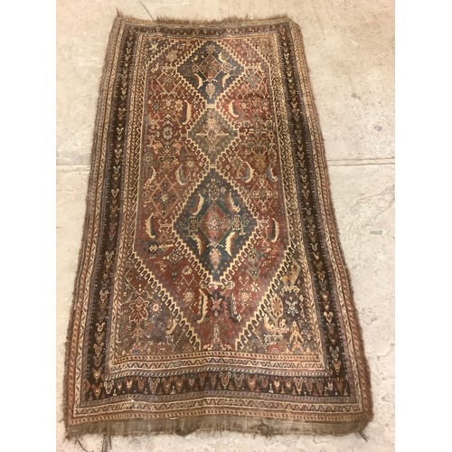 814 - A Middle Eastern rectangular wool rug or carpet, 223cm x 115cm