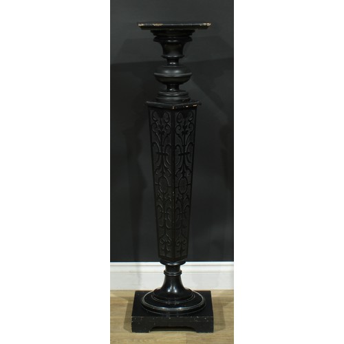 895 - A 19th century ebonised statuary pedestal, square plateau, tapered blind fretwork column, turned soc... 