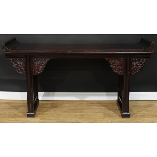 1019 - A Chinese altar table, rectangular top, shaped brackets moulded with leafy dragon heads, moulded leg... 