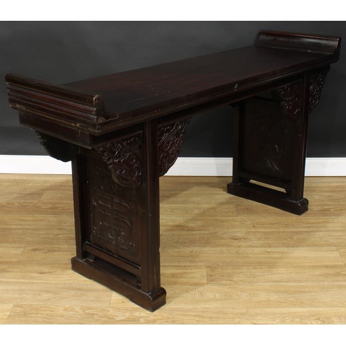 1019 - A Chinese altar table, rectangular top, shaped brackets moulded with leafy dragon heads, moulded leg... 