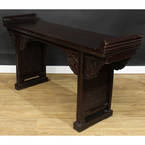 1019 - A Chinese altar table, rectangular top, shaped brackets moulded with leafy dragon heads, moulded leg... 