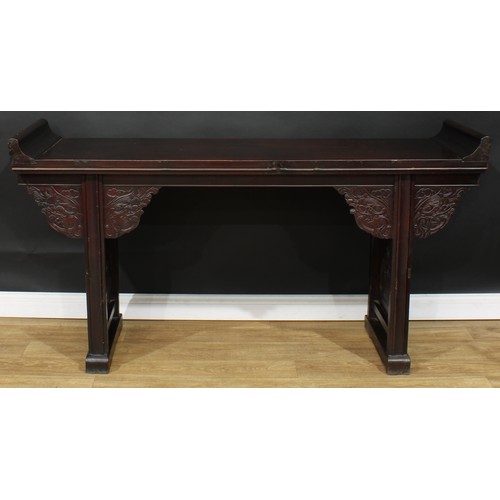 1019 - A Chinese altar table, rectangular top, shaped brackets moulded with leafy dragon heads, moulded leg... 