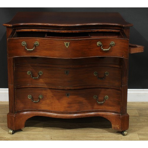 1228 - A George III mahogany serpentine secretaire chest, slightly oversailing top with moulded edge above ... 