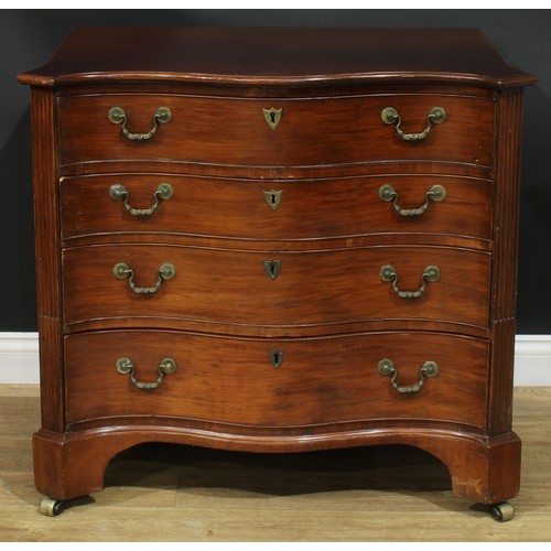 1228 - A George III mahogany serpentine secretaire chest, slightly oversailing top with moulded edge above ... 