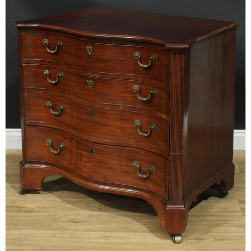 1228 - A George III mahogany serpentine secretaire chest, slightly oversailing top with moulded edge above ... 