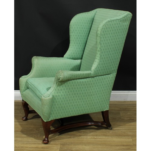 1088 - A George I Revival mahogany wingback armchair, stuffed-over upholstery, squab cushion, cabriole fore... 