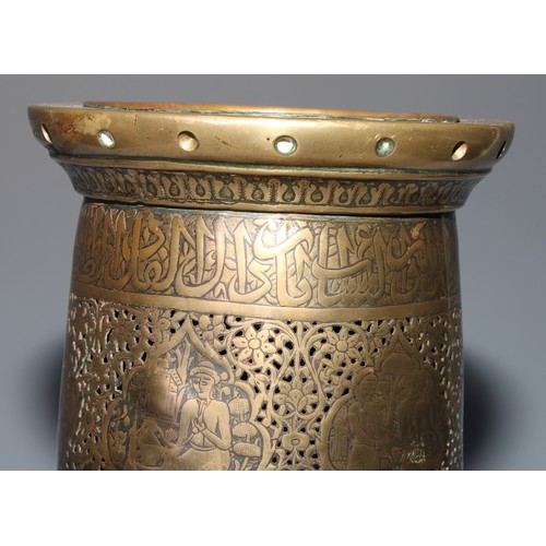 1191 - A pair of large Middle Eastern Islamic brass mosque candlesticks, pierced and engraved with a field ... 