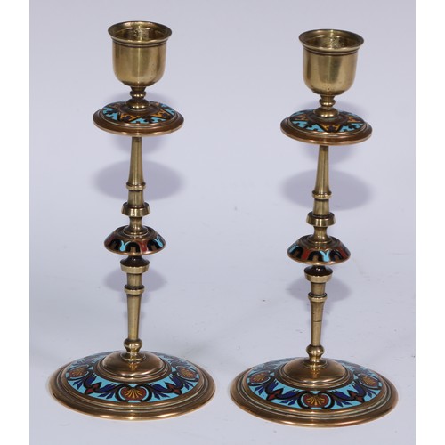 1187 - A pair of French champlevé enamel candlesticks, decorated in polychrome on a turquoise ground, 19.5c... 