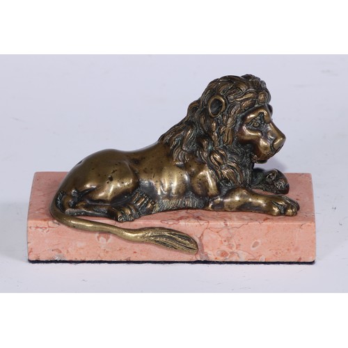 1462 - French School, 19th century, a pair of bronzes, recumbent lions, facing to dexter and sinister, marb... 