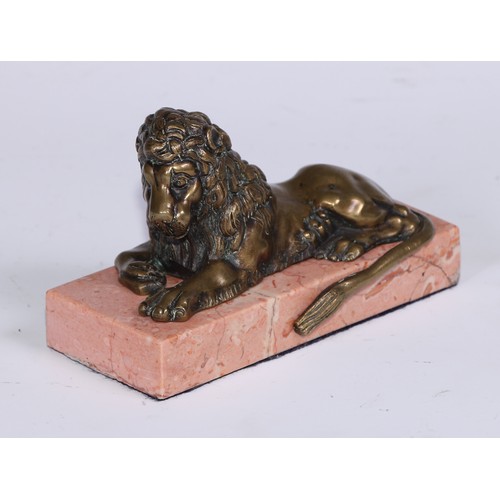 1462 - French School, 19th century, a pair of bronzes, recumbent lions, facing to dexter and sinister, marb... 