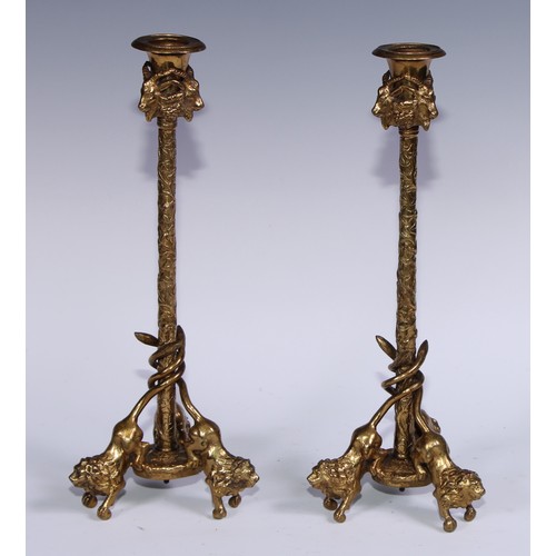 1188 - A pair of French gilt bronze tripod candlesticks, campana sconces with caprine masks, fruiting vine ... 