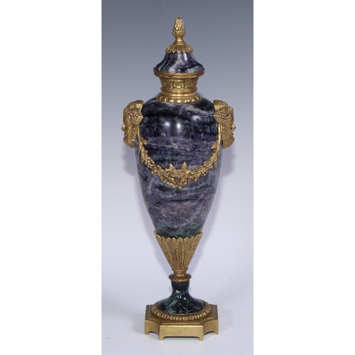 1193 - A pair of Louis XVI Revival gilt metal mounted fluorspar slender ovoid mantel urns, pineapple finals... 