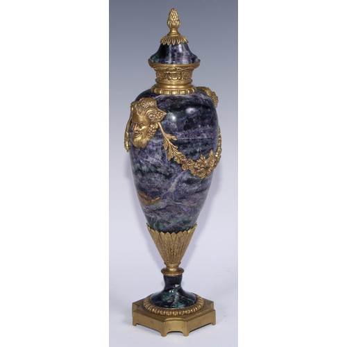 1193 - A pair of Louis XVI Revival gilt metal mounted fluorspar slender ovoid mantel urns, pineapple finals... 