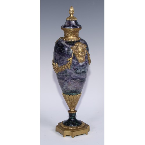 1193 - A pair of Louis XVI Revival gilt metal mounted fluorspar slender ovoid mantel urns, pineapple finals... 