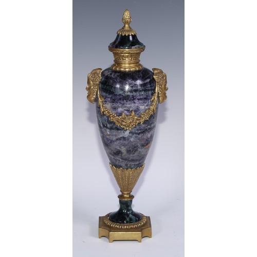 1193 - A pair of Louis XVI Revival gilt metal mounted fluorspar slender ovoid mantel urns, pineapple finals... 