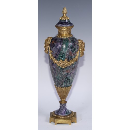 1193 - A pair of Louis XVI Revival gilt metal mounted fluorspar slender ovoid mantel urns, pineapple finals... 