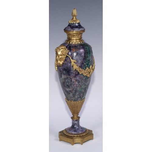 1193 - A pair of Louis XVI Revival gilt metal mounted fluorspar slender ovoid mantel urns, pineapple finals... 