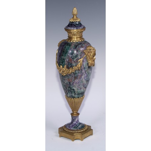 1193 - A pair of Louis XVI Revival gilt metal mounted fluorspar slender ovoid mantel urns, pineapple finals... 