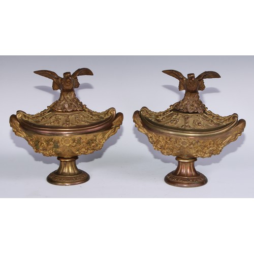 1195 - A pair of Neoclassical style gilt bronze navette shaped urns, eagle crestings, cast with flowers, ri... 