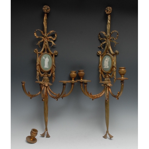 1304 - A pair of Adams style gilt metal wall lights, set with Wedgwood green jasper ware panel, ribbon tied... 